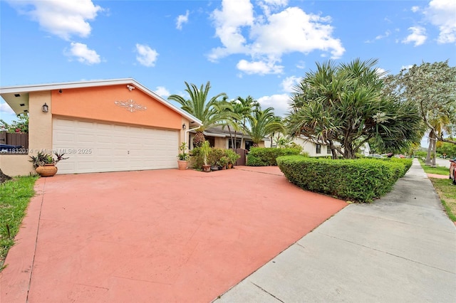 17130 SW 93rd Ave, Palmetto Bay, FL 33157 - view of front of house with stucco siding, a garage, and concrete driveway