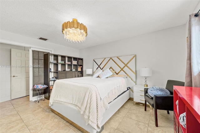 17130 SW 93rd Ave, Palmetto Bay, FL 33157 - bedroom with a chandelier, tile patterned floors, and a textured ceiling