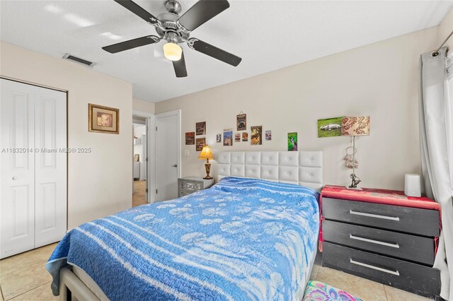 17130 SW 93rd Ave, Palmetto Bay, FL 33157 - bedroom featuring a ceiling fan, a closet, and tile patterned flooring