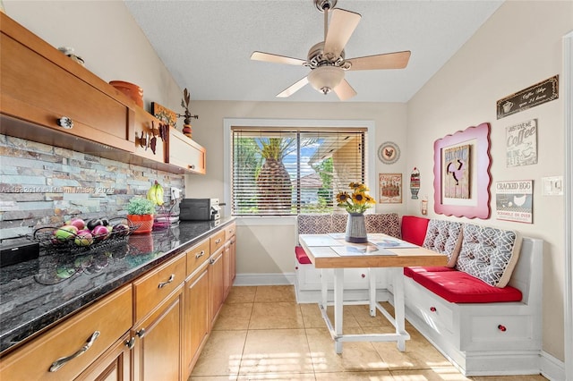 17130 SW 93rd Ave, Palmetto Bay, FL 33157 - dining area featuring a ceiling fan, light tile patterned floors, and a textured ceiling