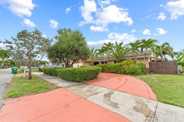 17130 SW 93rd Ave, Palmetto Bay, FL 33157 - view of front of property with a front yard, a gate, and stucco siding