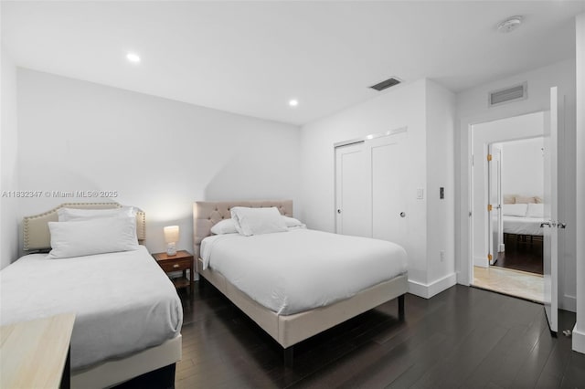 1231 96th St, Bay Harbor Islands, FL 33154 - bedroom with dark wood-style flooring, recessed lighting, and a closet