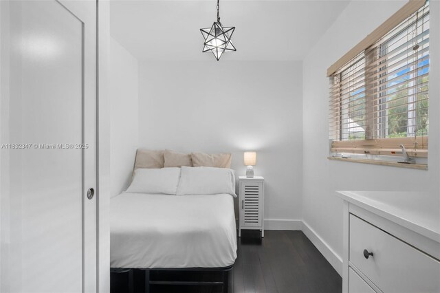 1231 96th St, Bay Harbor Islands, FL 33154 - bedroom with dark wood finished floors and baseboards