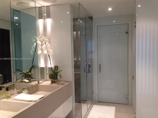 17121 Collins Ave Unit 2803, Sunny Isles Beach, FL 33160 - bathroom featuring vanity and a shower stall