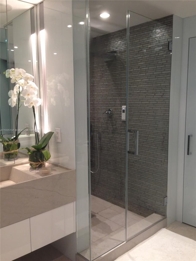 17121 Collins Ave Unit 2803, Sunny Isles Beach, FL 33160 - full bathroom featuring a shower stall and vanity
