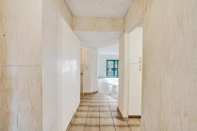 4965 E Sabal Palm Blvd Unit 207, Tamarac, FL 33319 - kitchen featuring stainless steel appliances, dark countertops, a textured ceiling, ceiling fan, and white cabinetry