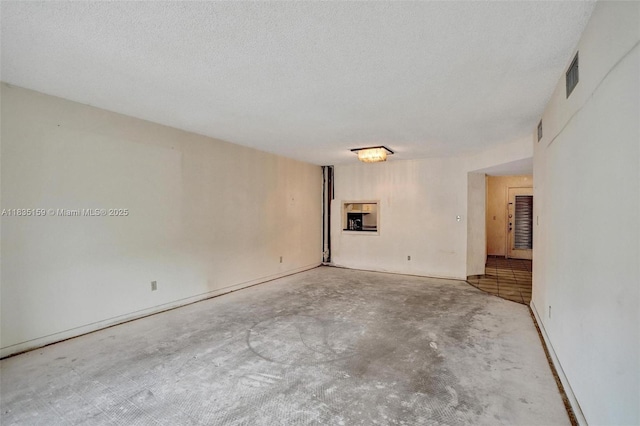 4965 E Sabal Palm Blvd Unit 207, Tamarac, FL 33319 - empty room with unfinished concrete flooring and a textured ceiling