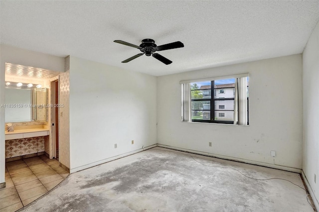 4965 E Sabal Palm Blvd Unit 207, Tamarac, FL 33319 - unfurnished bedroom featuring ensuite bathroom, a ceiling fan, and a textured ceiling