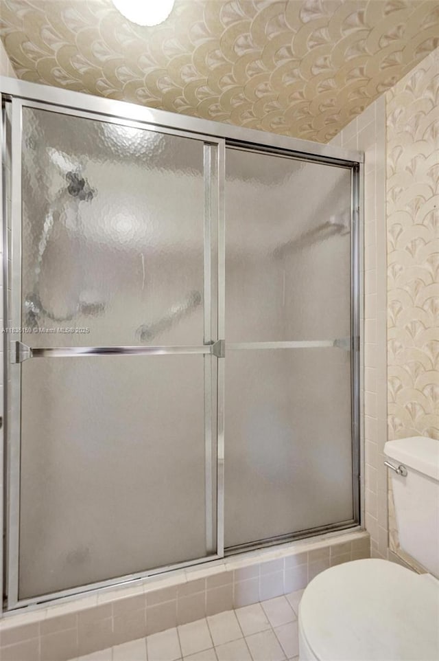 4965 E Sabal Palm Blvd Unit 207, Tamarac, FL 33319 - bathroom with wallpapered walls and a tile shower