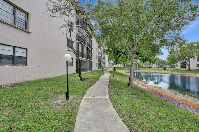 4965 E Sabal Palm Blvd Unit 207, Tamarac, FL 33319 - view of community with a yard and a water view