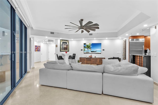 333 Las Olas Way Unit 405, Fort Lauderdale, FL 33301 - living room featuring ceiling fan, bar with sink, crown molding, and a raised ceiling