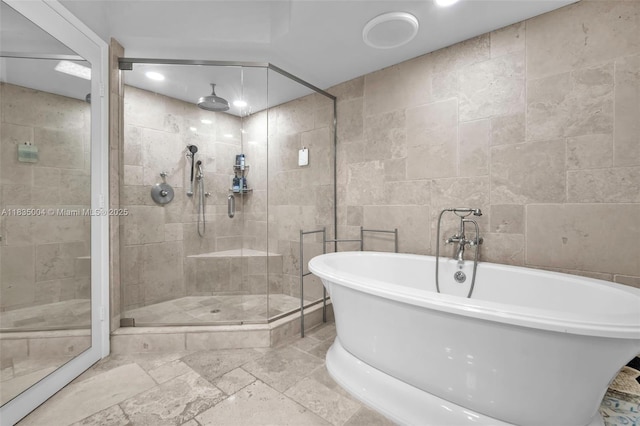 333 Las Olas Way Unit 405, Fort Lauderdale, FL 33301 - full bath with a stall shower, a freestanding tub, and recessed lighting