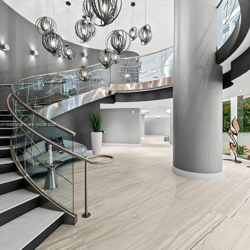 333 Las Olas Way Unit 405, Fort Lauderdale, FL 33301 - stairway featuring a towering ceiling