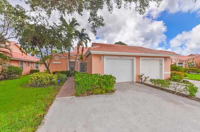 5570 Royal Lake Cir, Boynton Beach, FL 33437 - view of front facade with stucco siding, a tiled roof, a front lawn, an attached garage, and driveway