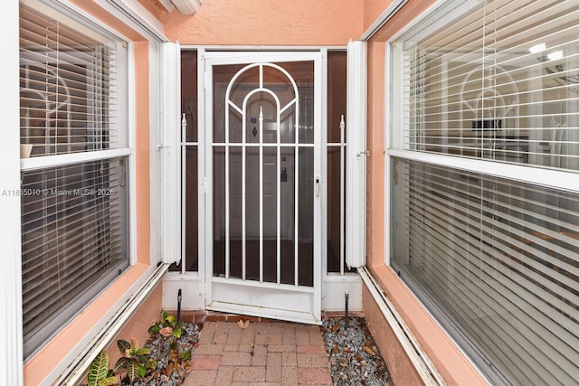 5570 Royal Lake Cir, Boynton Beach, FL 33437 - doorway to property with stucco siding