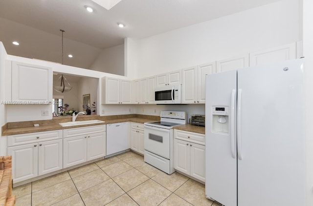 5570 Royal Lake Cir, Boynton Beach, FL 33437 - kitchen featuring white appliances, high vaulted ceiling, light tile patterned floors, white cabinets, and recessed lighting