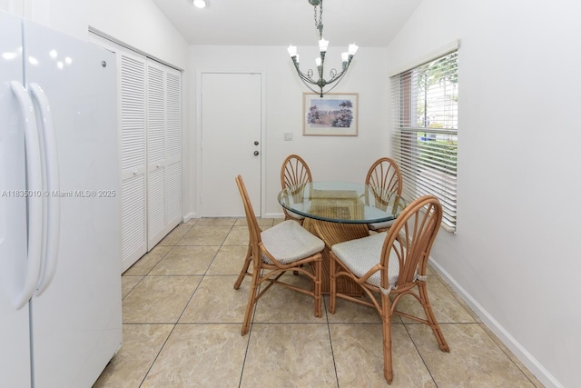5570 Royal Lake Cir, Boynton Beach, FL 33437 - dining space featuring a chandelier and light tile patterned floors