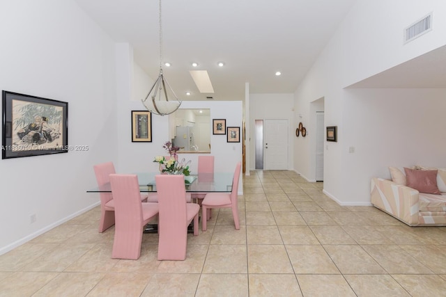 5570 Royal Lake Cir, Boynton Beach, FL 33437 - dining room with light tile patterned floors, recessed lighting, a skylight, and high vaulted ceiling