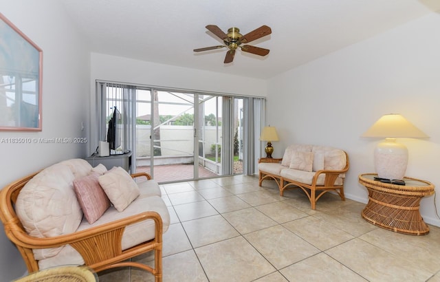 5570 Royal Lake Cir, Boynton Beach, FL 33437 - living room with light tile patterned floors and a ceiling fan
