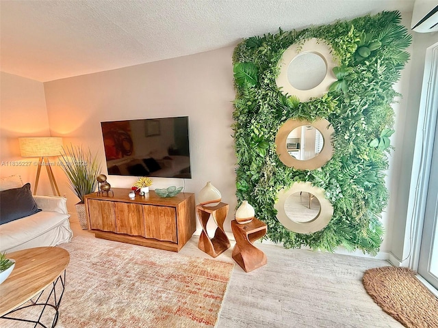 224 Meridian Ave Unit 10, Miami Beach, FL 33139 - living room with a wall mounted AC, a textured ceiling, and wood finished floors