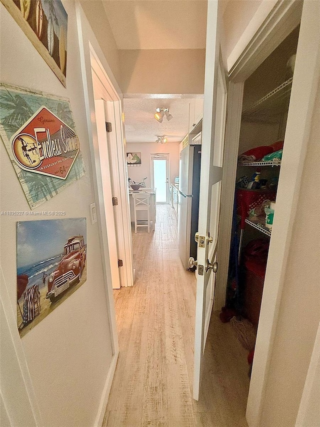224 Meridian Ave Unit 10, Miami Beach, FL 33139 - hallway featuring light wood-type flooring
