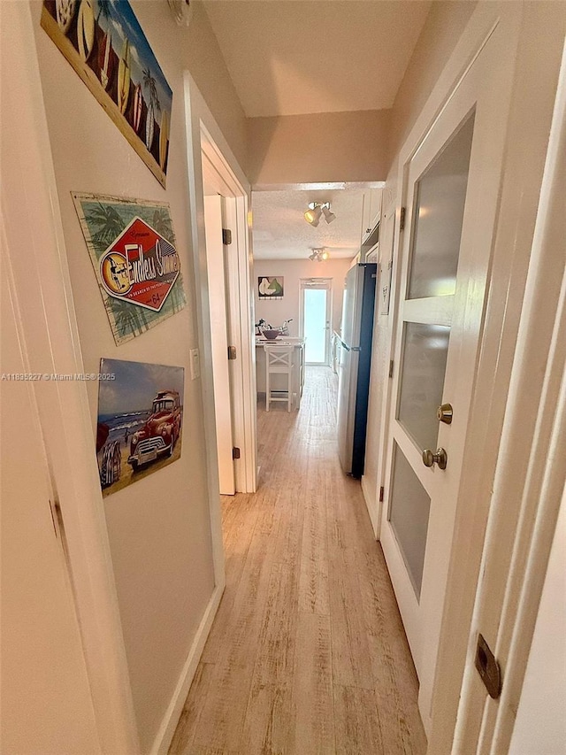 224 Meridian Ave Unit 10, Miami Beach, FL 33139 - hall featuring light wood-type flooring and baseboards