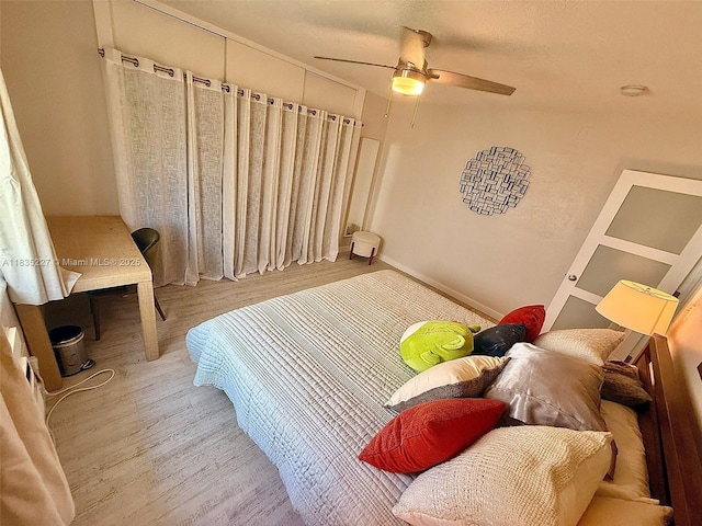 224 Meridian Ave Unit 10, Miami Beach, FL 33139 - bedroom with wood finished floors and a ceiling fan