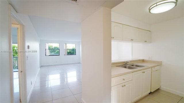 8100 Geneva Ct Unit 343, Doral, FL 33166 - kitchen featuring white dishwasher, light tile patterned floors, light countertops, and white cabinets