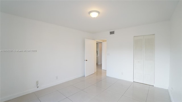 8100 Geneva Ct Unit 343, Doral, FL 33166 - unfurnished bedroom with a closet and light tile patterned floors