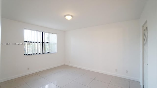 8100 Geneva Ct Unit 343, Doral, FL 33166 - unfurnished room with baseboards and light tile patterned floors