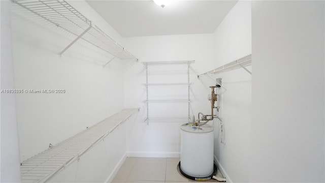 8100 Geneva Ct Unit 343, Doral, FL 33166 - walk in closet with water heater and light tile patterned floors
