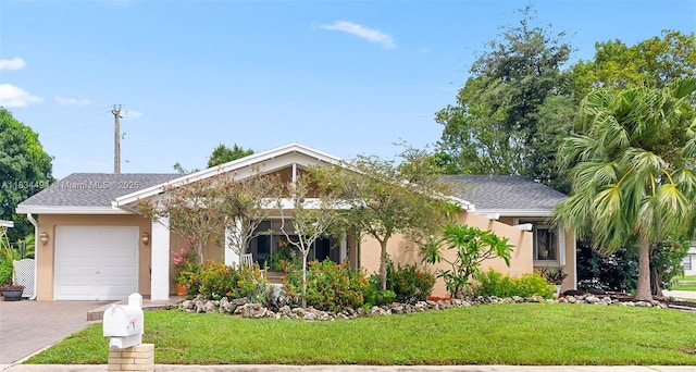 5001 SW 11th Cir, Margate, FL 33068 - view of front of house with stucco siding, a garage, a front lawn, and asphalt driveway
