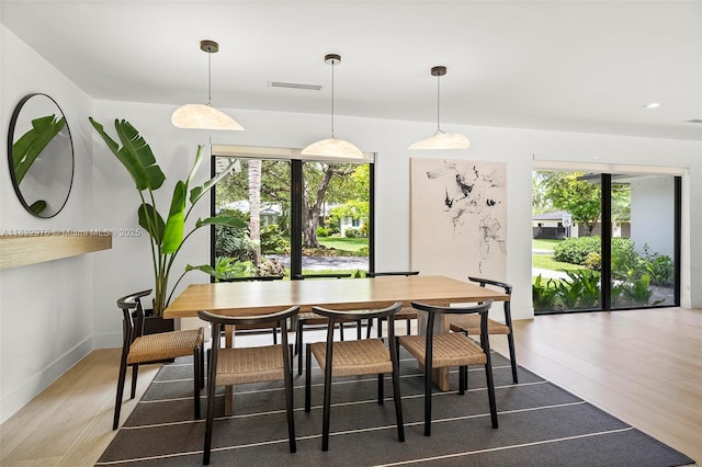 15121 SW 69th Ct, Palmetto Bay, FL 33158 - dining space with light wood-style flooring and baseboards