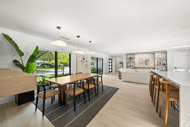 15121 SW 69th Ct, Palmetto Bay, FL 33158 - dining area with light wood finished floors and recessed lighting