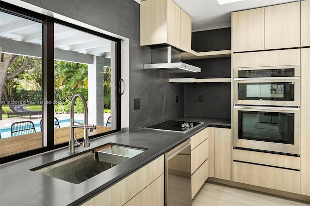 15121 SW 69th Ct, Palmetto Bay, FL 33158 - kitchen with appliances with stainless steel finishes, light brown cabinetry, wall chimney exhaust hood, and tasteful backsplash