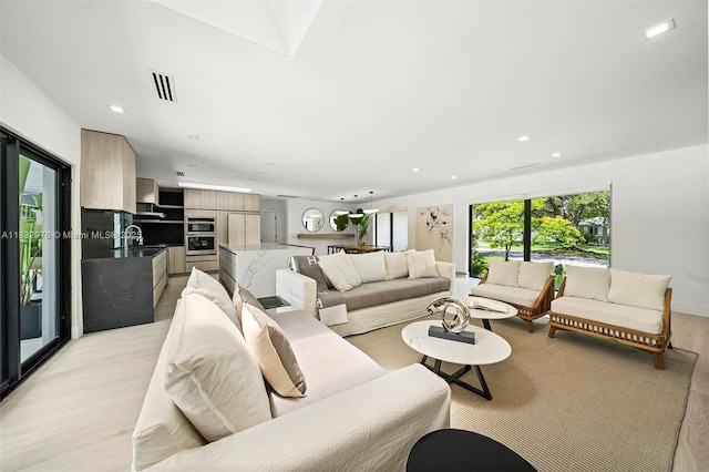 15121 SW 69th Ct, Palmetto Bay, FL 33158 - living area featuring light wood-type flooring and recessed lighting