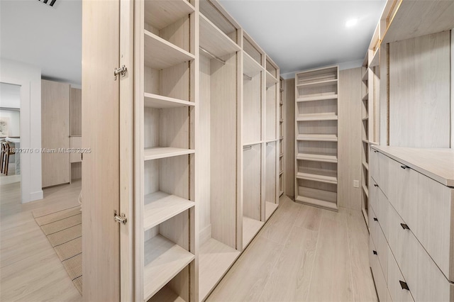 15121 SW 69th Ct, Palmetto Bay, FL 33158 - spacious closet with light wood-style flooring