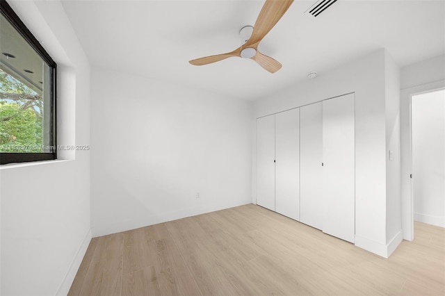 15121 SW 69th Ct, Palmetto Bay, FL 33158 - unfurnished bedroom with light wood-style floors, a closet, and a ceiling fan