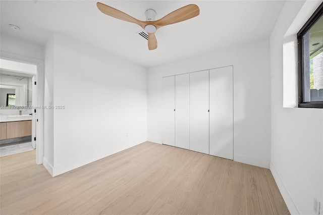 15121 SW 69th Ct, Palmetto Bay, FL 33158 - unfurnished bedroom with light wood-type flooring, a closet, and ceiling fan