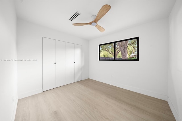 15121 SW 69th Ct, Palmetto Bay, FL 33158 - unfurnished bedroom featuring light wood-style floors, a closet, and ceiling fan