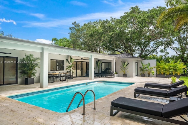 15121 SW 69th Ct, Palmetto Bay, FL 33158 - outdoor pool with a ceiling fan, a patio area, and outdoor dining space