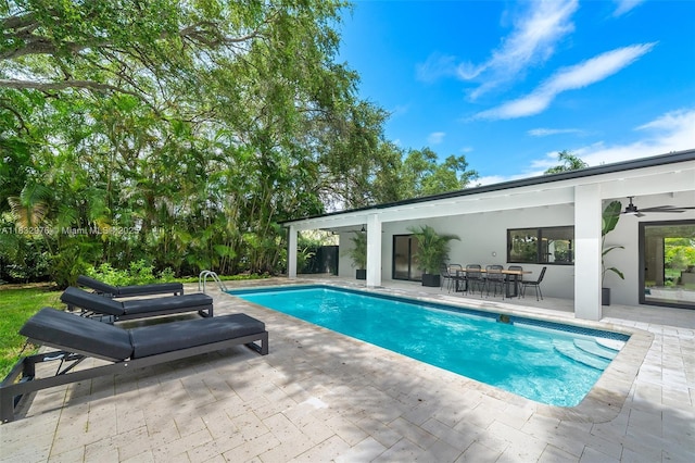 15121 SW 69th Ct, Palmetto Bay, FL 33158 - outdoor pool with a ceiling fan, a patio area, and outdoor dining area