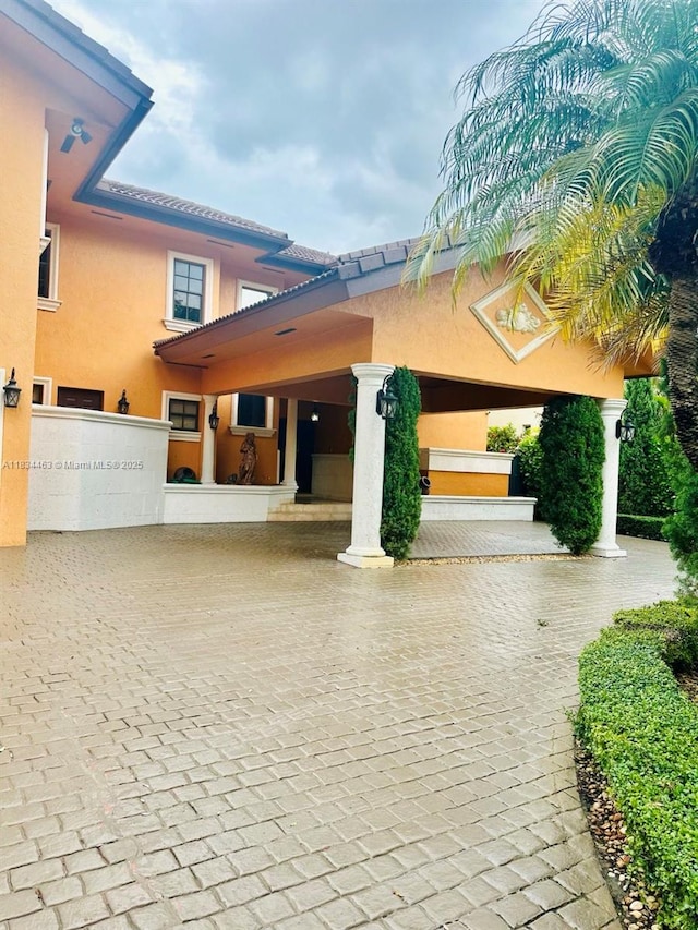 8565 NW 168th Ter, Miami Lakes, FL 33016 - exterior space featuring stucco siding and a tile roof