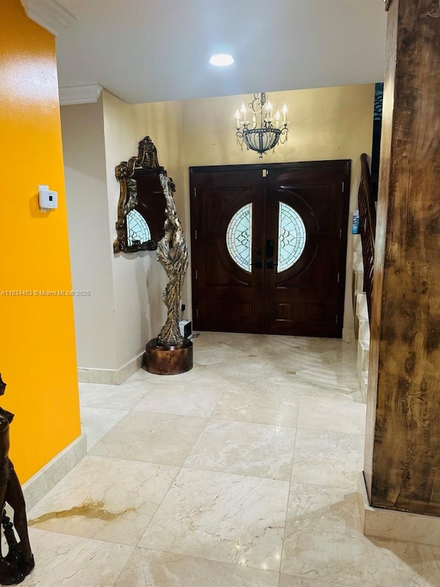 8565 NW 168th Ter, Miami Lakes, FL 33016 - foyer featuring a chandelier, french doors, and marble finish floors