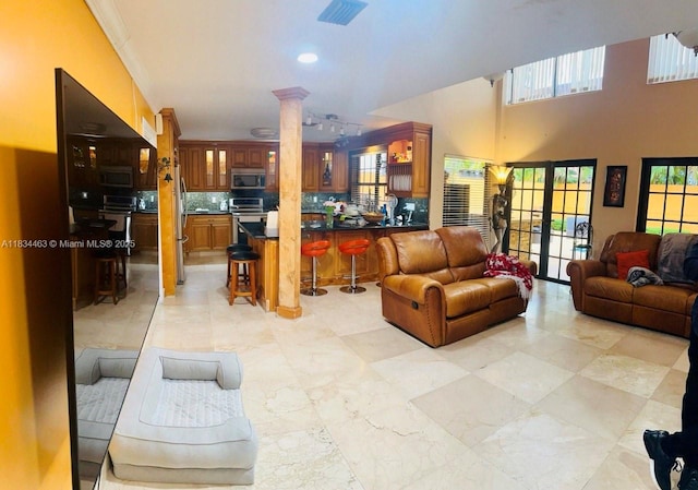 8565 NW 168th Ter, Miami Lakes, FL 33016 - living area with decorative columns and recessed lighting