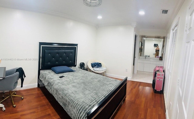 8565 NW 168th Ter, Miami Lakes, FL 33016 - bedroom featuring wood finished floors, crown molding, recessed lighting, and connected bathroom