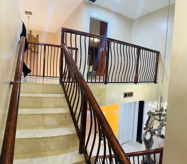 8565 NW 168th Ter, Miami Lakes, FL 33016 - staircase featuring a chandelier