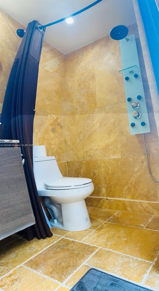 8565 NW 168th Ter, Miami Lakes, FL 33016 - full bath featuring tiled shower and stone tile flooring