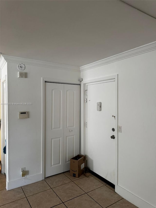 2201 NW 41st Ave Unit 108, Lauderhill, FL 33313 - entrance foyer featuring light tile patterned floors and crown molding