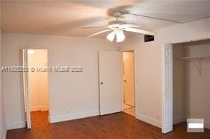 2201 NW 41st Ave Unit 108, Lauderhill, FL 33313 - unfurnished bedroom featuring a closet and wood finished floors